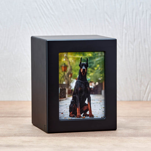 Photo box urn with satin black finish and a compartment to store ashes while keeping a photo on display.