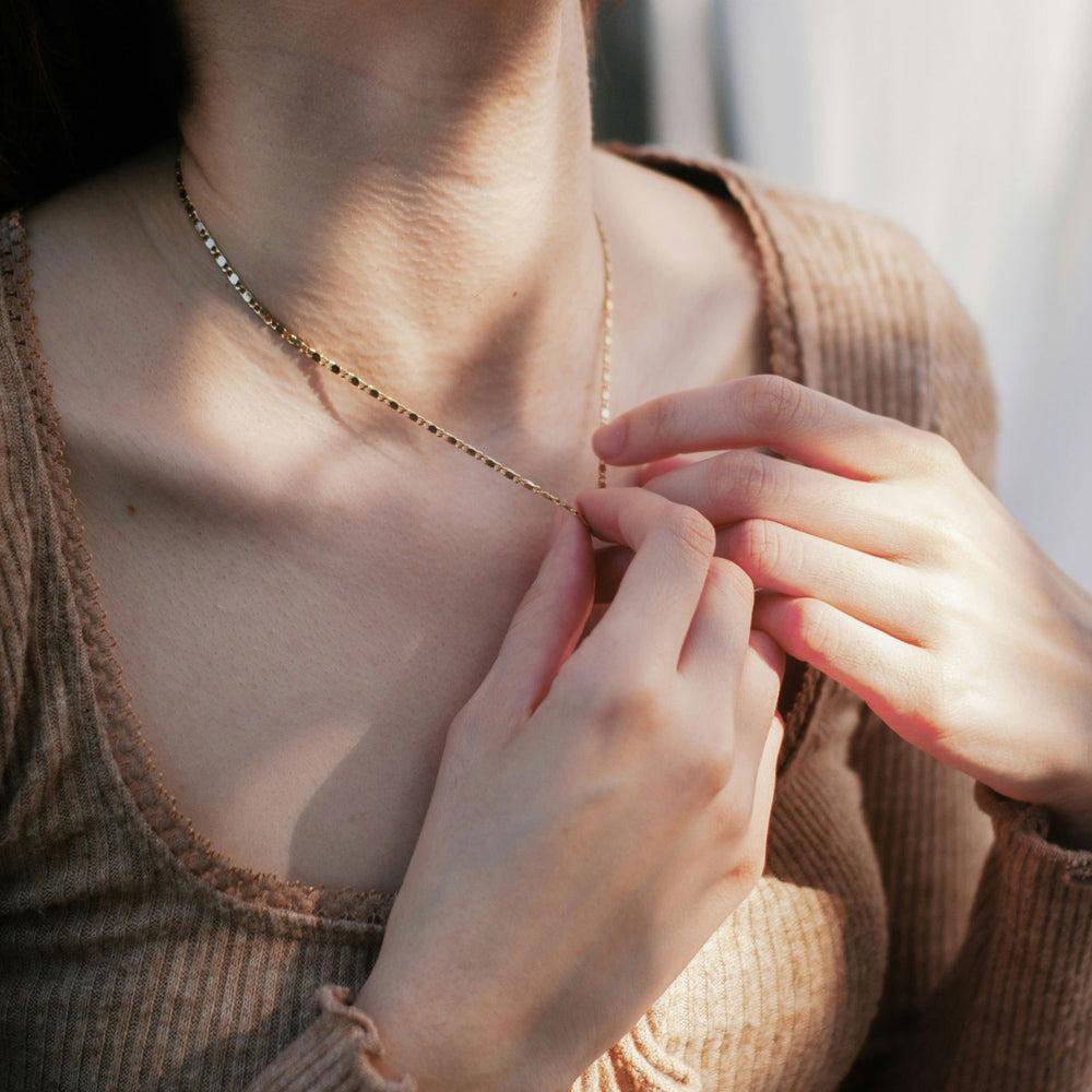 woman with cremation urn necklace