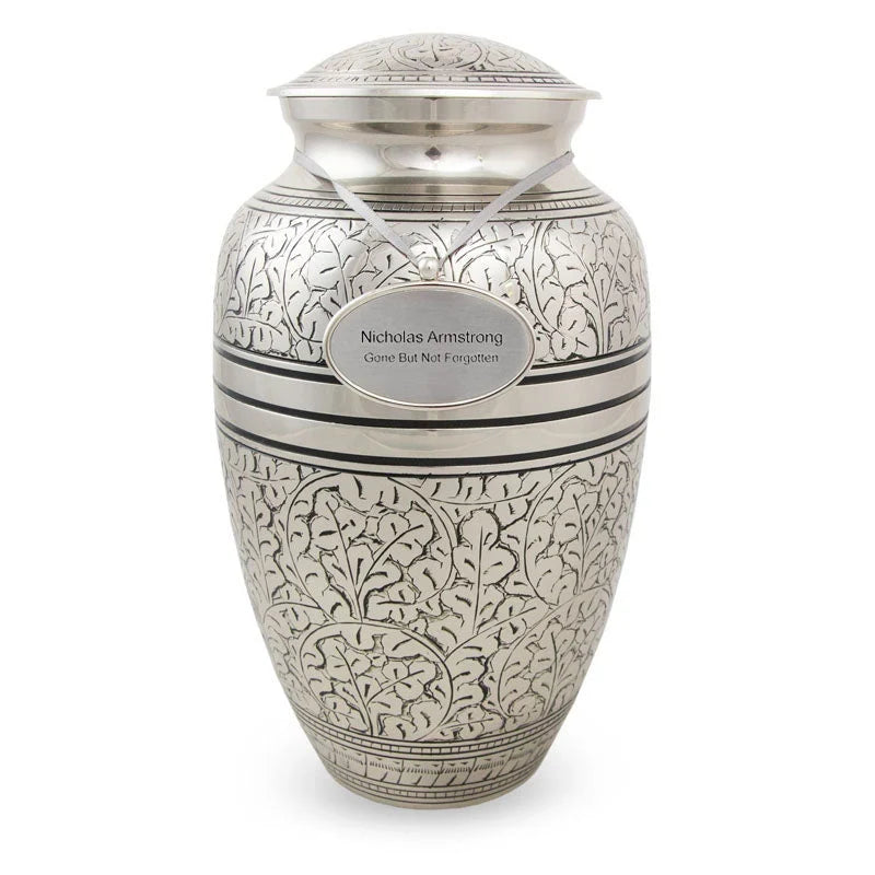 Traditional Brass Cremation Urn with a polished pewter finish featuring an etched leaf design main image.