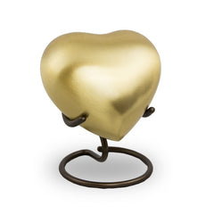 Gold-tone heart keepsake urn with circular base and curved loop stand