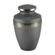 Pewter cremation urn with domed lid and decorative floral band in relief