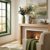 Classic brass cremation urn in a pewter finish featuring two etched leaf bands in a home decor setting.