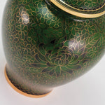 Green cloisonne urn featuring a delicate floral motif and gold accents, detail image.