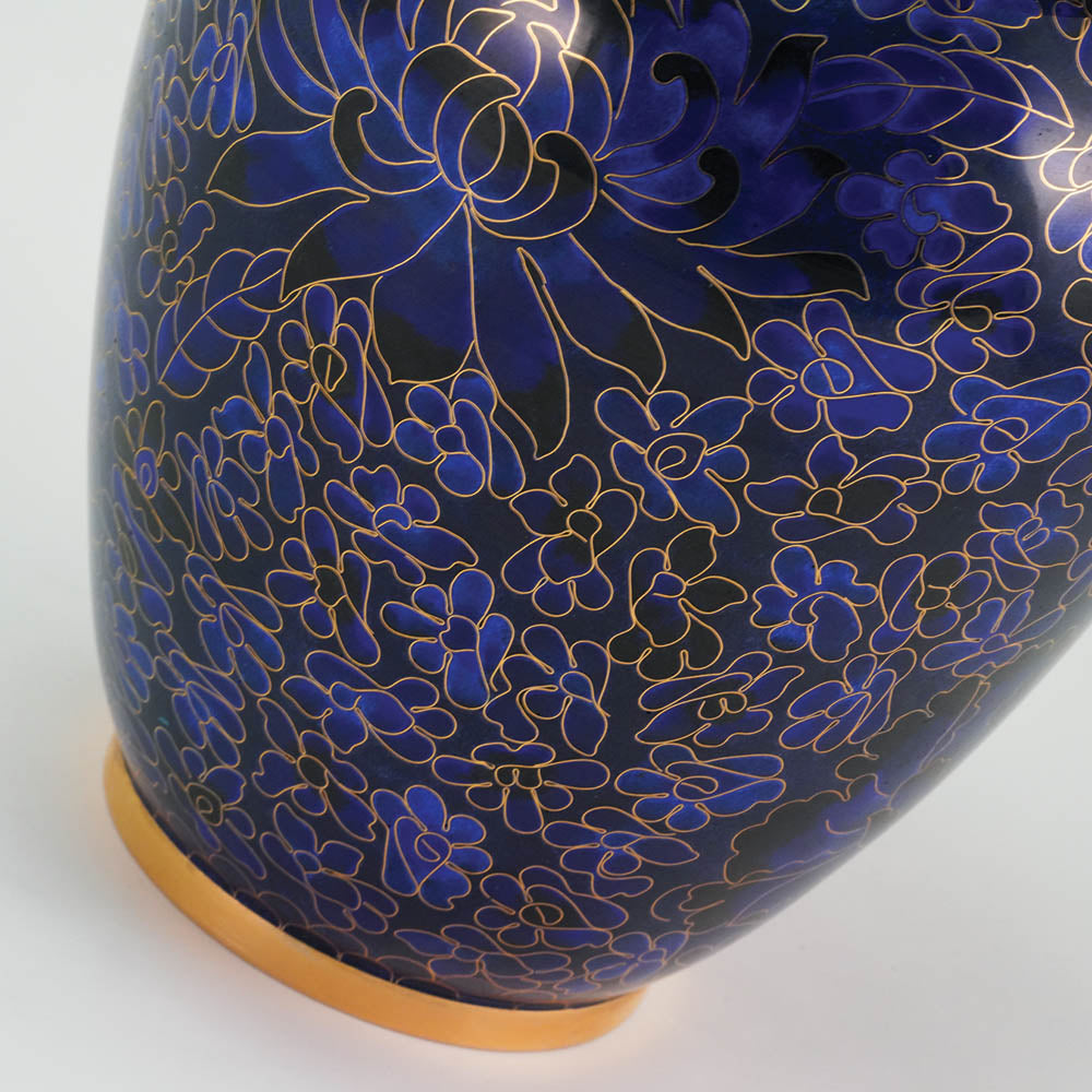 Vibrant blue cloisonne urn featuring a delicate floral motif with gold accents, detail image.