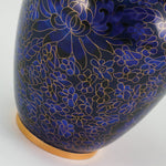 Vibrant blue cloisonne urn featuring a delicate floral motif with gold accents, detail image.