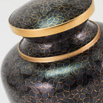 Stunning Black, grey, and onyx cloisonne cremation urn featuring a floral motif with gold accents, detail image. 