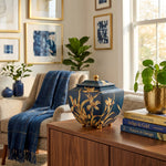 Pagoda style blue resin urn featuring orchids in a home decor setting.