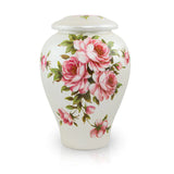 Large white ceramic cremation urn with pink rose bouquet floral design and domed lid
