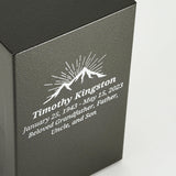 A bold steel urn box with antique bronze powder coat textured finish close up image of personalization.