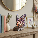 Intricately detailed pink and purple stained glass butterfly memory lamp with keepsake compartment for cremation ashes in a home decor setting.