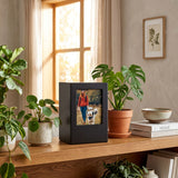 Black photo urn in a home decor setting.