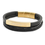 Black braided leather bracelet with gold accents with engraving.