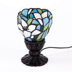 Stained glass lily shade table lamp with blue and green glass and dark scalloped base