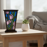 Pink Tulip Stained Glass Cremation Urn on a table.