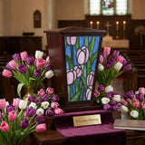 Pink Tulip Stained Glass Cremation Urn in a funeral service setting.