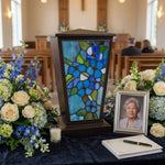Blue Forget-Me-Not Stained Glass Cremation Urn in a funeral service setting.