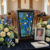 Blue Forget-Me-Not Stained Glass Cremation Urn in a funeral service setting.