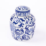A white ceramic ginger jar urn with a lid, decorated with an intricate blue floral and scroll pattern, set against a plain white background.