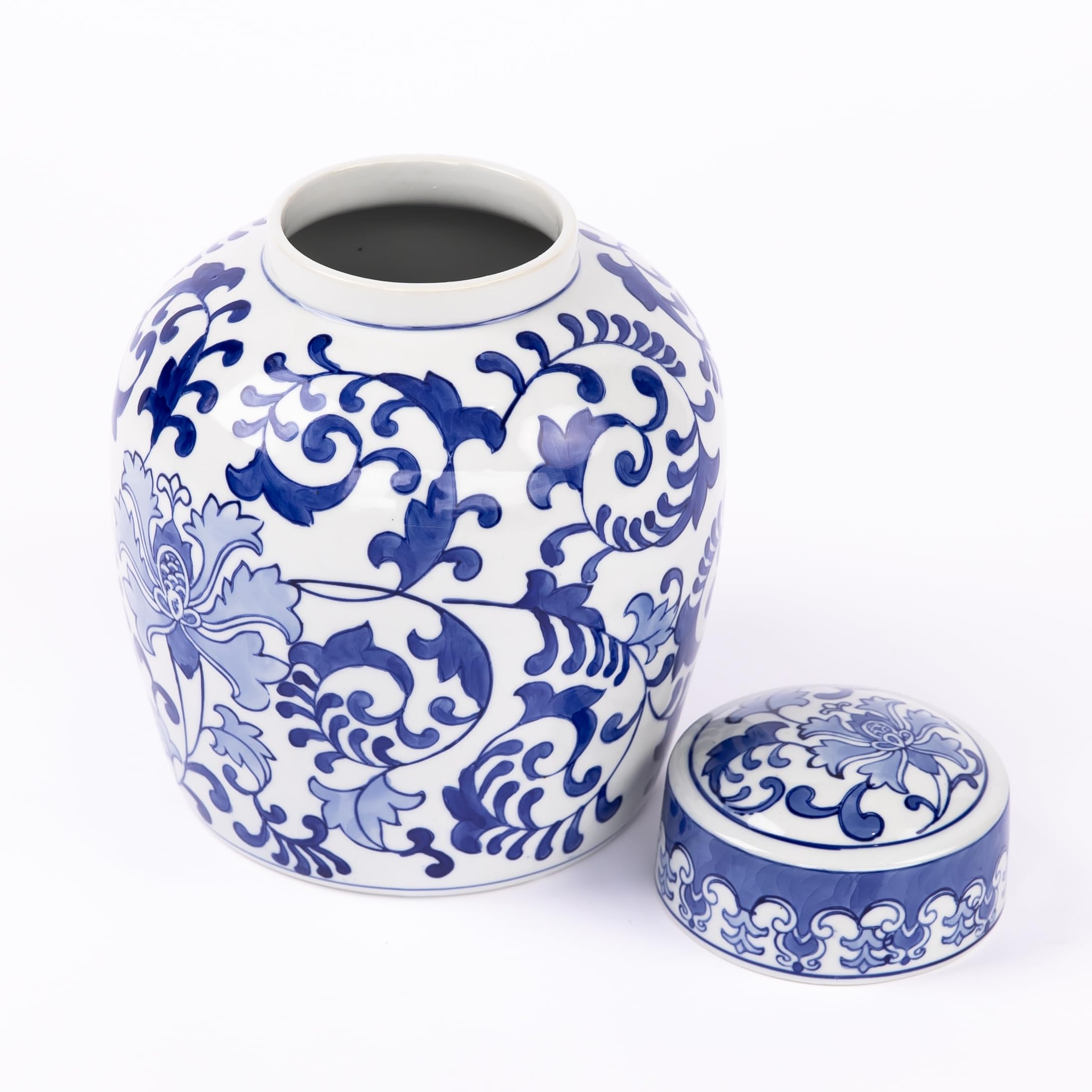 Blue and white ceramic cremation urn with ornate floral pattern and open top