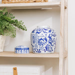 Blue and white ceramic cremation urn with matching lid on display shelf