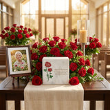 Natural white marble cremation box urn with hand engraved red rose design in a funeral service setting.