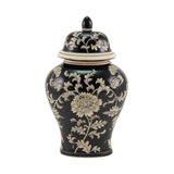 A black ceramic lidded urn in ginger jar style with a cream floral chinoiserie pattern, photographed against a solid white background.