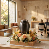 Classic slate metal cremation urn in a funeral service setting.