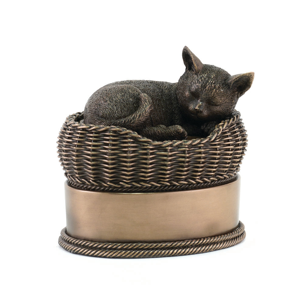 Pet urn in the shape of a cat in a basket main image.