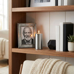 Aluminum cremation keepsake with memory tealight candle holder in a pewter finish in a home decor setting.