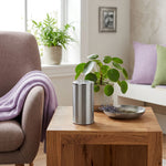 Keepsake for ashes with memory tealight candle in a grey finish with pewter accents in a home decor setting.