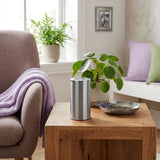 Keepsake for ashes with memory tealight candle in a grey finish with pewter accents in a home decor setting.
