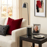 Keepsake for ashes with memory tealight candle in a black finish with pewter accents in a home decor setting.