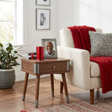Aluminum cremation keepsake with memory tealight candle holder in a crimson red finish in a home decor setting.