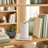 Aluminum cremation keepsake with memory tealight candle holder in a pearl white finish in a home decor setting.