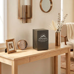 A bold steel urn box with antique bronze powder coat textured finish in a home decor setting with personalization.