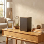 A bold steel urn box with antique bronze powder coat textured finish in a home decor setting.