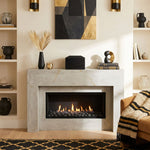 Natural black marble cremation urn in a modern shape above a fireplace.
