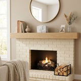 Natural white marble box  with grey veining in a home decor setting above a fireplace.