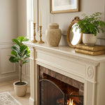 Beige natural marble urn with unique brown, white, and tan veining in a home decor setting.