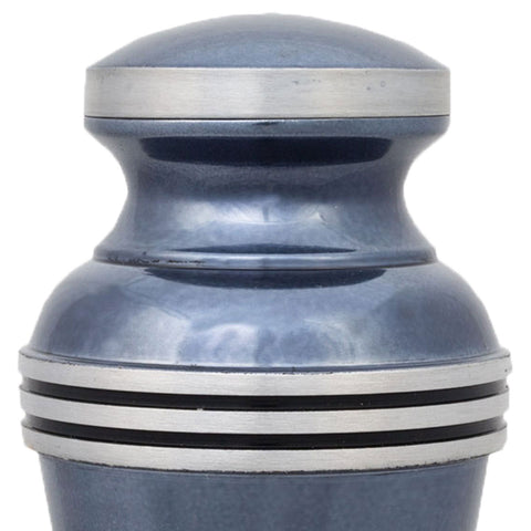 Light blue keepsake urn for up to three cubic inches of ash with metallic blue finish and pewter colored trim and bands.