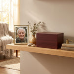 Traditional MDF cremation urn featuring a cherry wood veneer finish in a home decor setting.