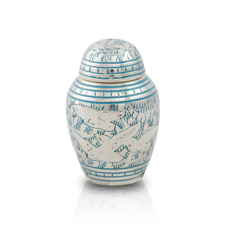 Small keepsake urn for ashes with intricate etched pattern of doves in flight with blue paint fill.