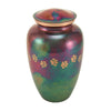 Bright purple and green raku finish cremation urn for pets with etched paw prints wrapping around the urn.