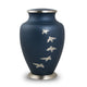 Blue metal urn with pewter bird silhouettes  flying in an arc up the urn main image.