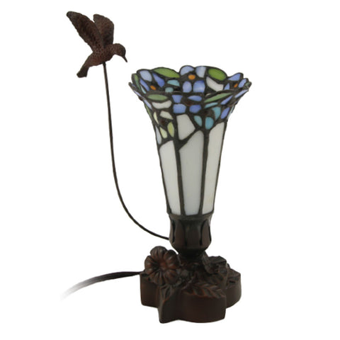 Tiffany styled cremation keepsake lamp that resembles a hummingbird feeding from a flower, with white and blue tones.