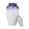Large urn for adults with pewter toned lid leaning up against purple and white body of the urn.