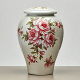 Large vase shaped cremation urn for ashes with a beautiful hand painted pattern of red and pink roses with delicate green leaves.