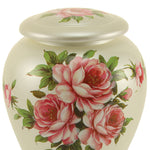 Detail of hand painted pink roses and green leaves in a bouquet pattern on a white ceramic vase shaped urn.