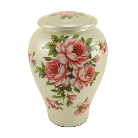 Ceramic cremation urn for adult ashes with painted bouquet of pink roses resting on engraved marble base.