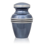 Light blue small keepsake urn for up to three cubic inches of ash with metallic blue finish and pewter colored trim and bands.